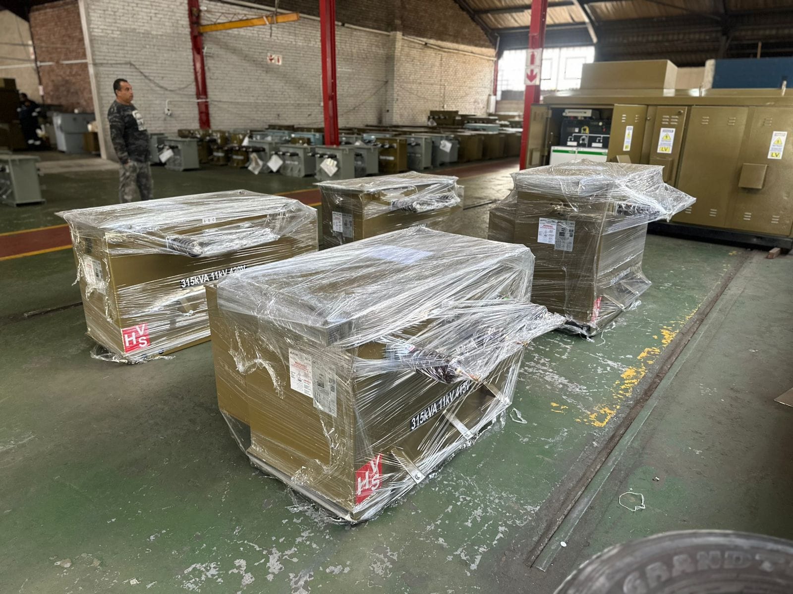 Palletized, shrink-wrapped refurbished transformers ready for delivery